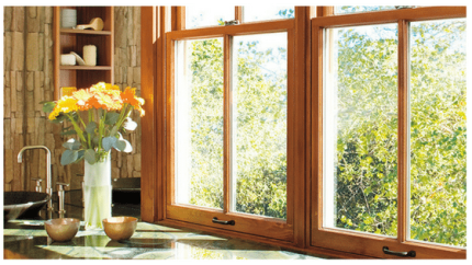 Flowers on a windowsill, beautiful wooden window frame behind