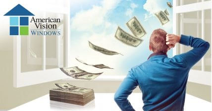 Image of man looking out window watching dollars fly out the window